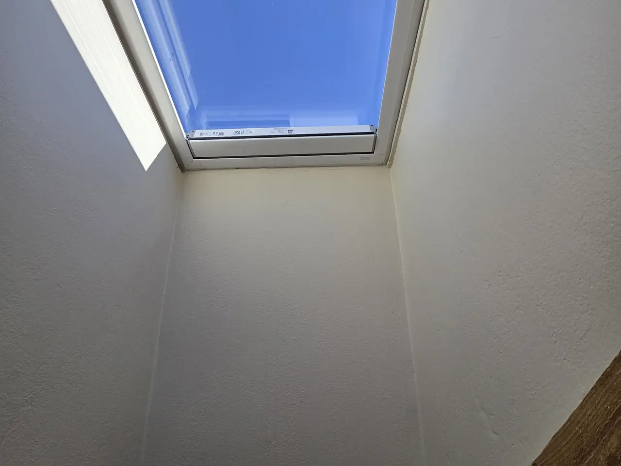 Before: the dated cream skylight shaft