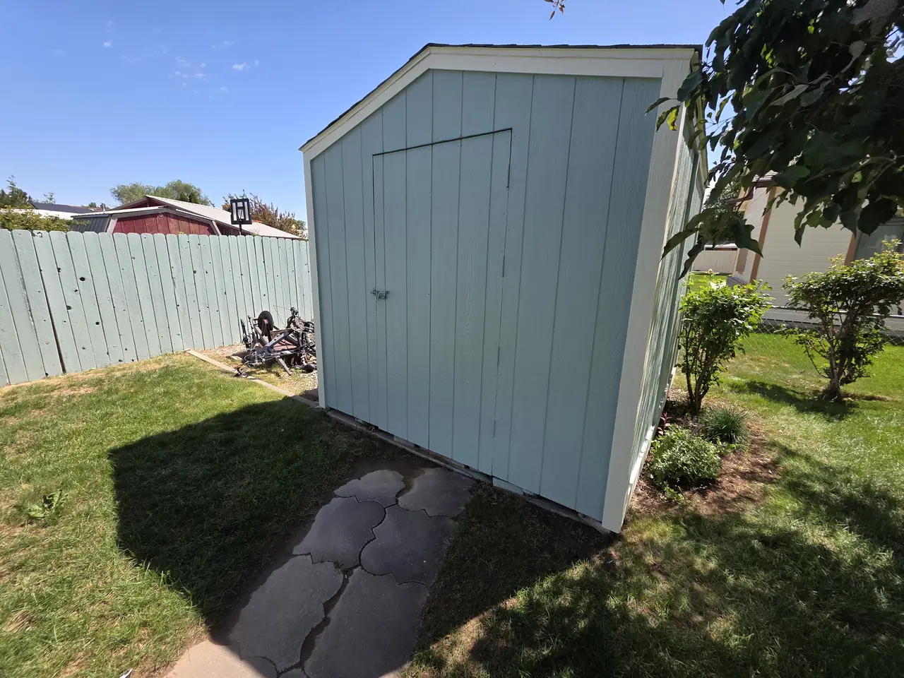 Backyard shed painted to match the house