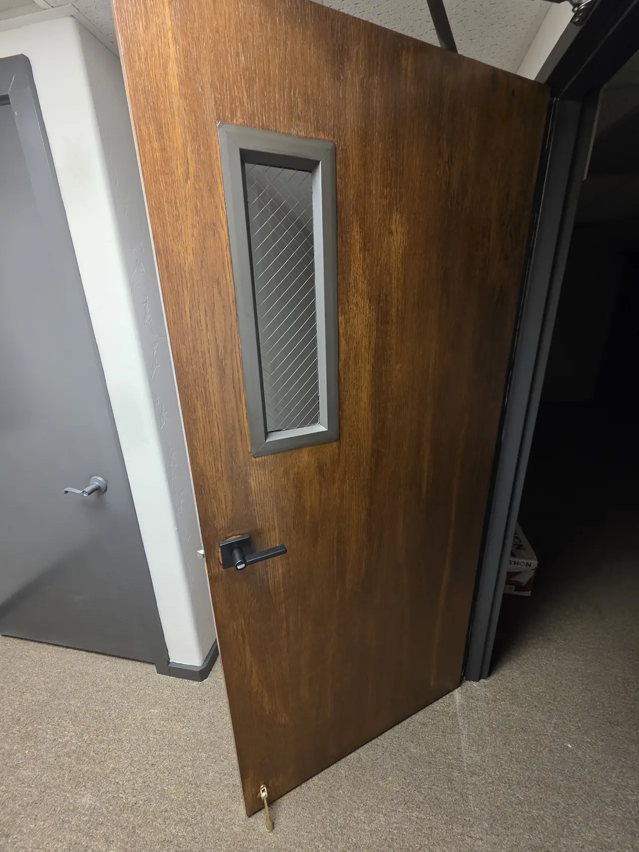 Interior door refinished in a rich brown stain